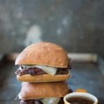 An image of two french dip sandwiches on ciabatta buns.