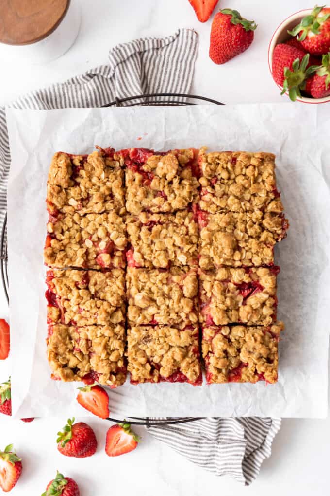 Cutting the strawberry rhubarb oat bars into twelve rectangles.