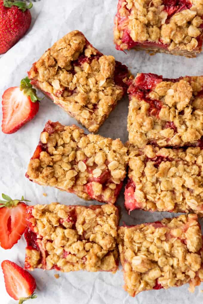 An overhead image of strawberry rhubarb bars that have been cut into squares.