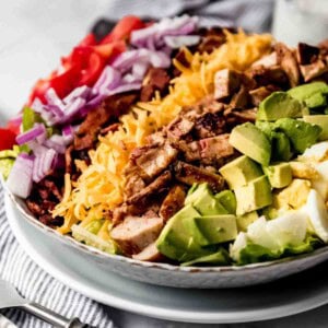 A side view of a grilled chicken cobb salad.