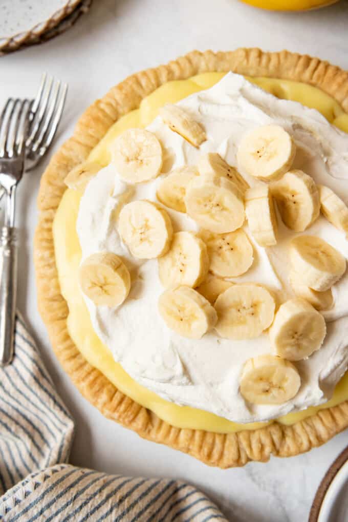 An overhead image of a banana cream pie in a homemade pie crust.