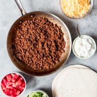 An image of taco meat made with homemade taco seasoning and fixing for ground beef tacos.