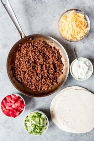 An image of taco meat made with homemade taco seasoning and fixing for ground beef tacos.