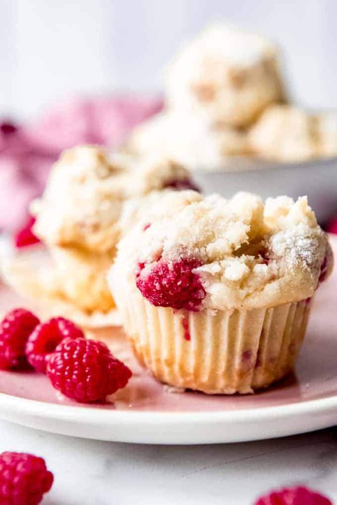 An image of fresh raspberry muffins with streusel topping.