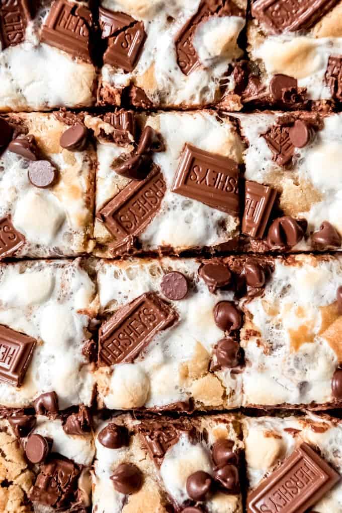 An image of s'mores bars topped with Hershey's chocolate squares and toasted marshmallows.