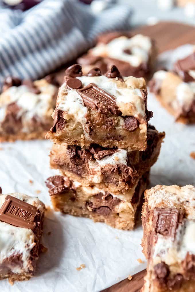 An image of s'mores bars cut into squares and stacked on top of each other.