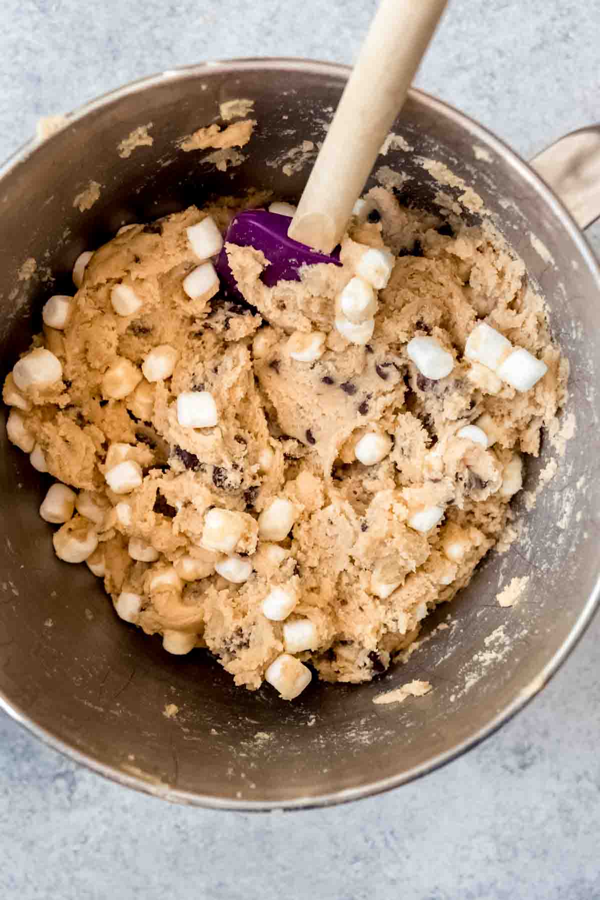 An image of chocolate chip cookie dough with marshmallows in it.