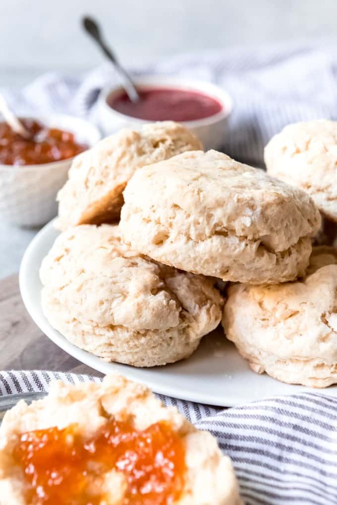 An image of homemade biscuits piled on a plate.