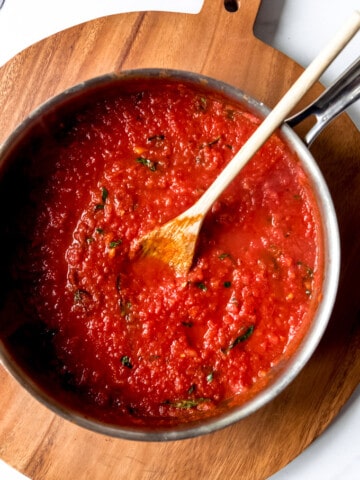 An image of a pot of homemade tomato basil marinara sauce.