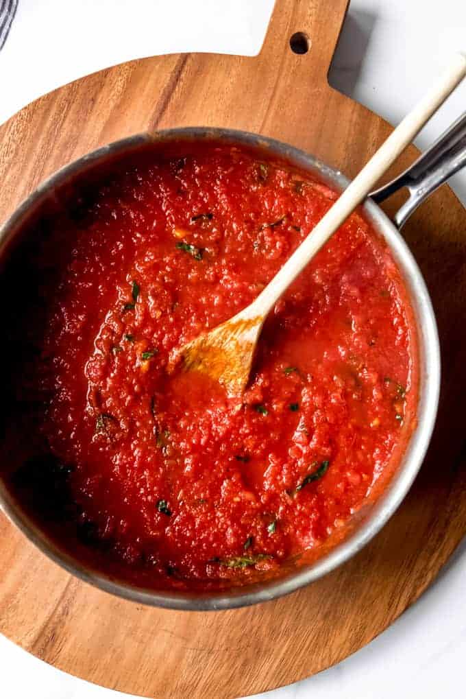 An image of a pot of homemade tomato basil marinara sauce.