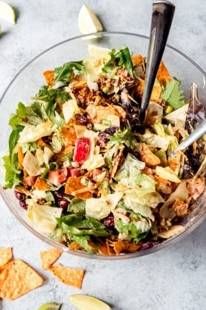 An image of a taco salad tossed with Thousand Island dressing and Nacho Cheese Doritos.