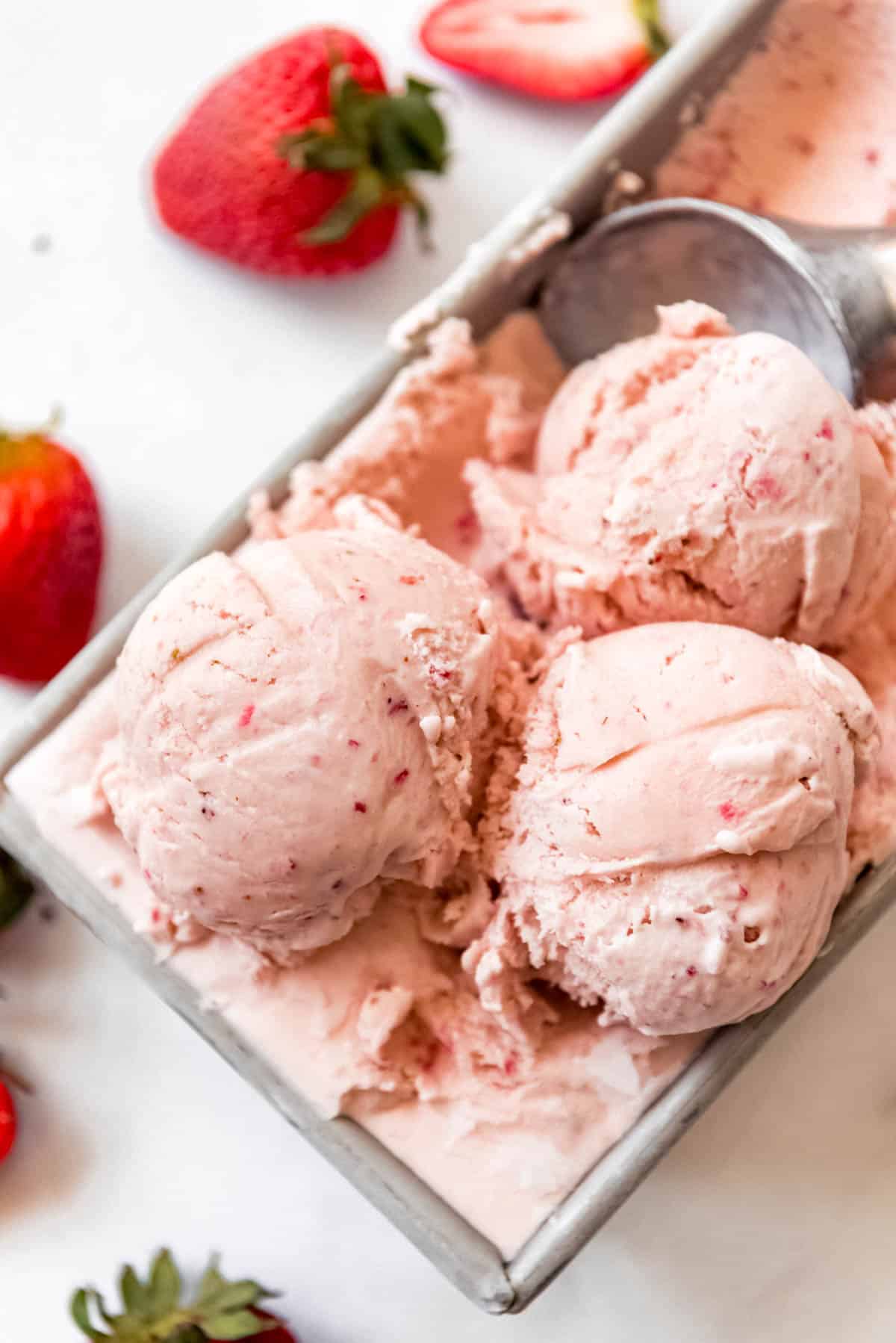 scoops of slow-churned homemade strawberry ice cream