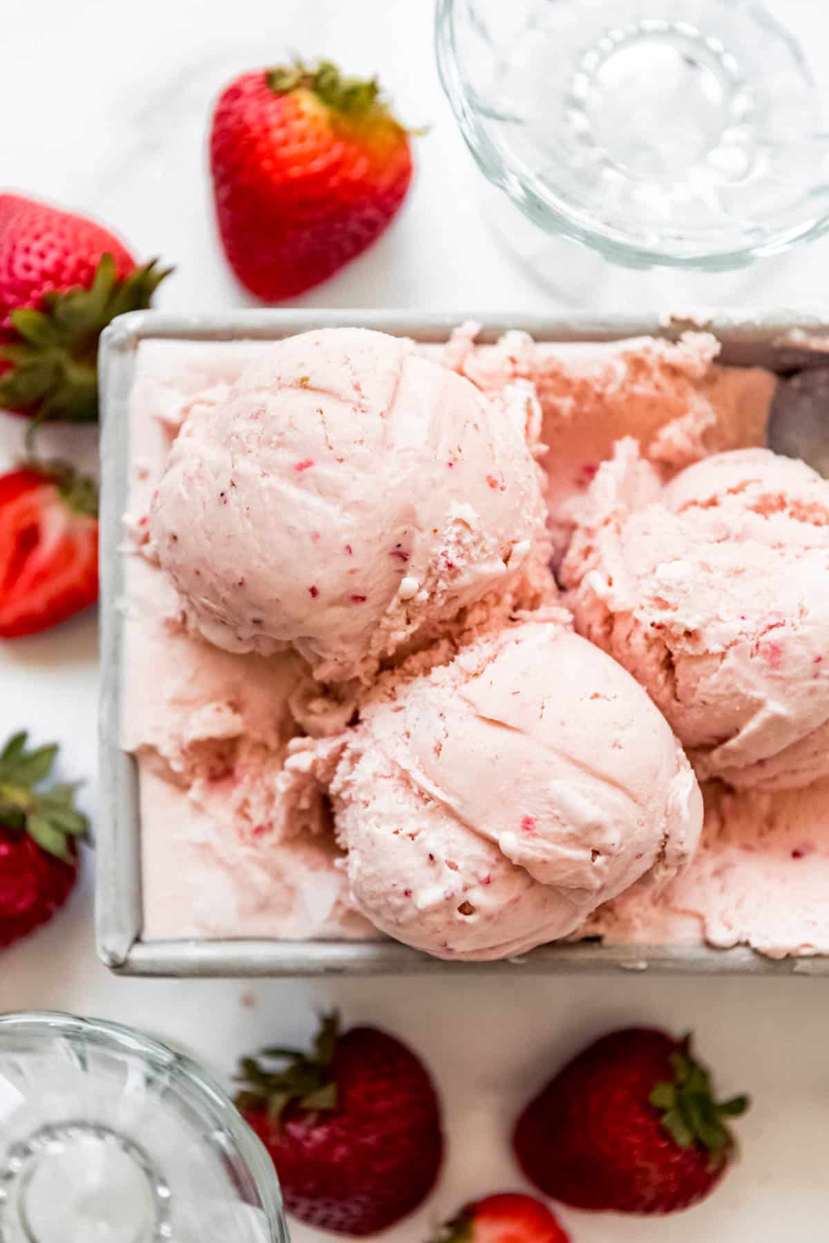 a close image of scoops of homemade strawberry ice cream