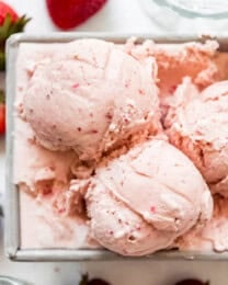 a close image of scoops of homemade strawberry ice cream