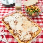 This cheesy baked spaghetti casserole is kid-friendly, filling, and perfect for feeding a crowd. Melty cheese, meaty sauce, and al dente pasta make this a great weeknight meal!