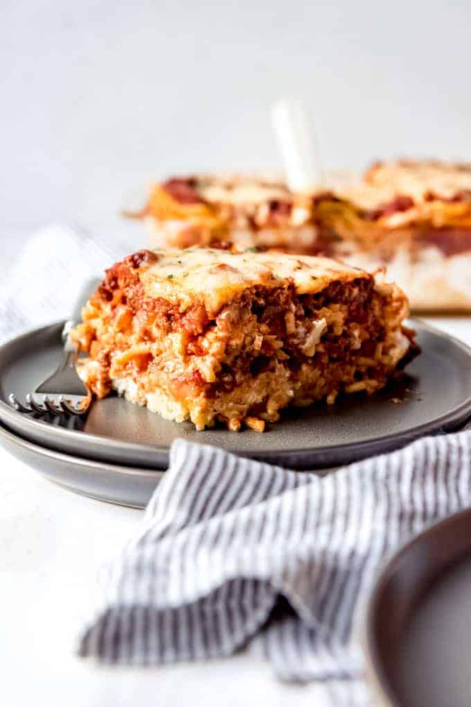 An image of a slice of baked spaghetti casserole on a plate.