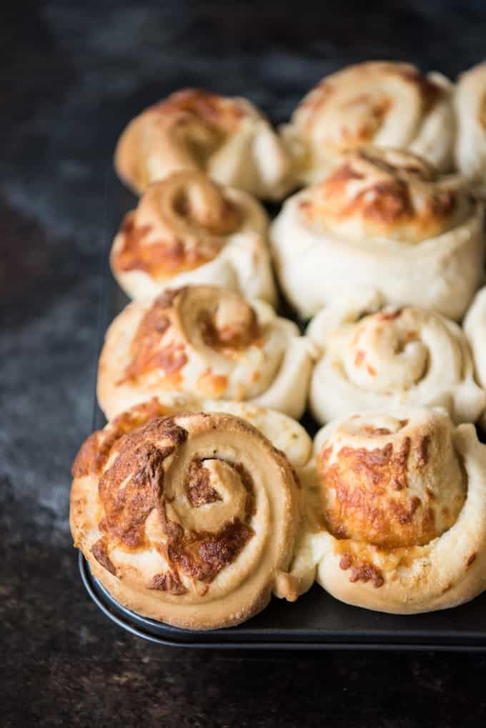Cheesy Garlic Mozzarella Swirl Rolls in a muffin pan