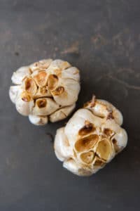 two heads of roasted garlic