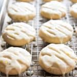 double lemon glazed cookies on a wire cooling rack