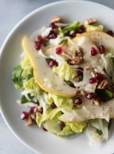 Winter Pear, Pomegranate & Swiss Salad is a gorgeous way to use some of the best fruits of the season and perfect for any holiday dinner. The homemade Poppy Seed Dressing that goes with it is a family recipe that has been passed down and it makes a wonderful DIY Christmas gift for friends & neighbors.