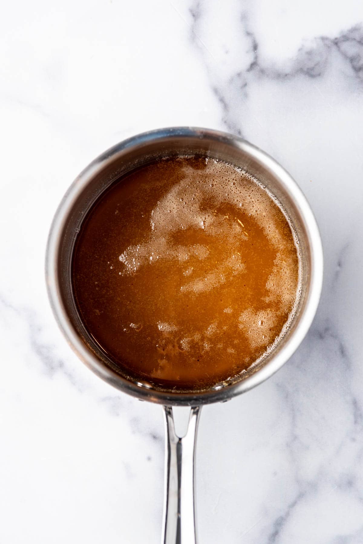 Salad dressing ingredients in a small saucepan.