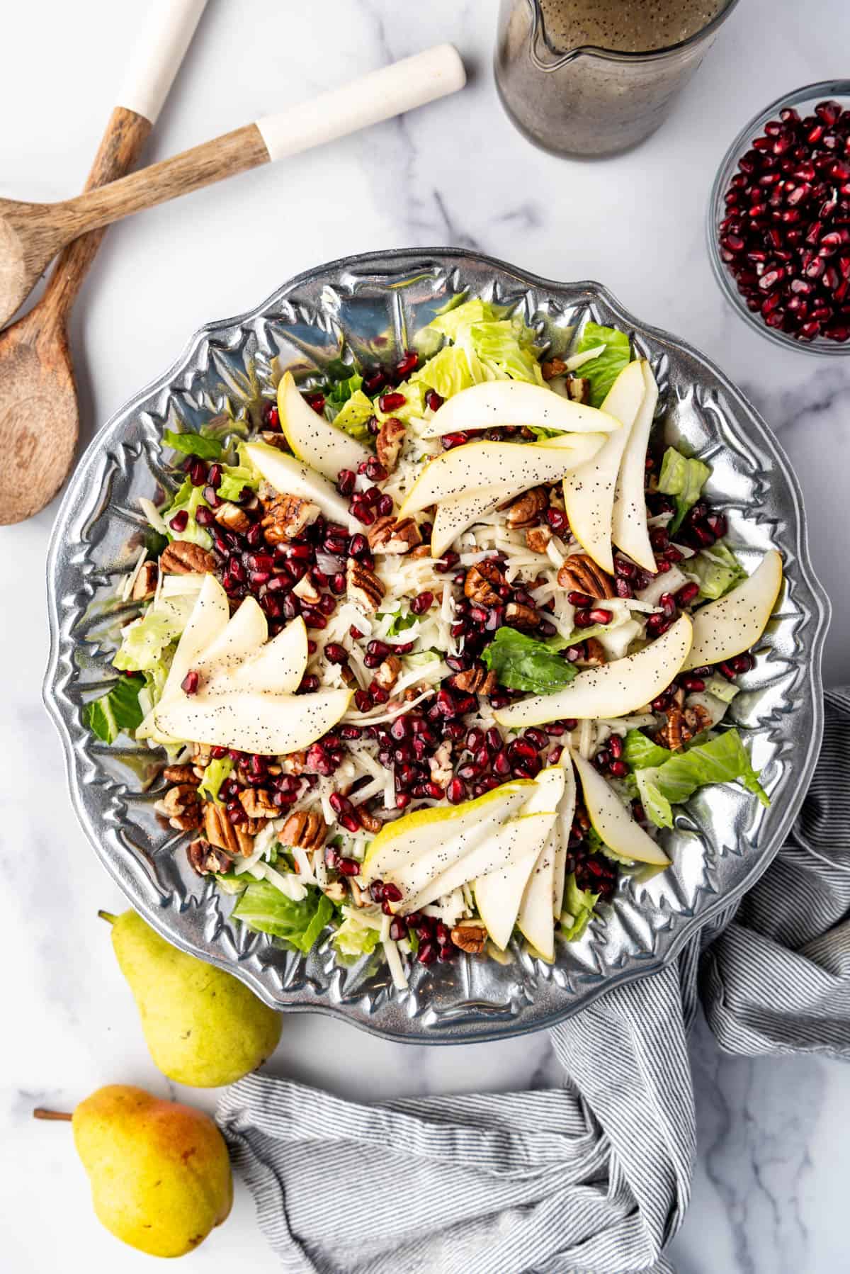 An overhead image of a winter pear and pomegranate salad.