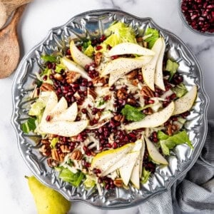 An overhead image of a winter pear and pomegranate salad.