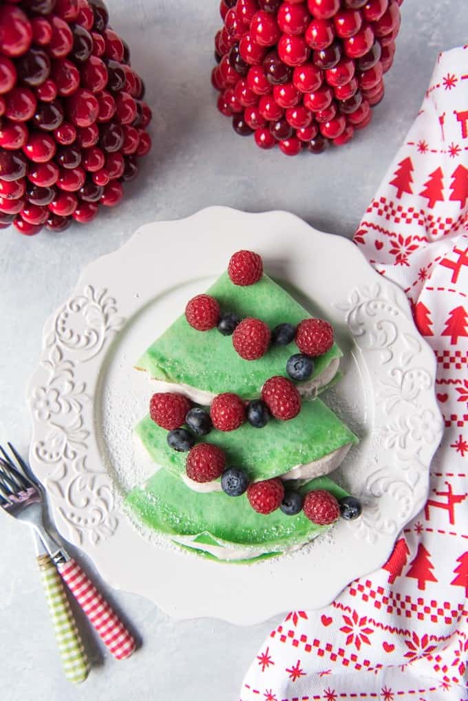 Christmas Tree Crepes with Gingerbread Spice Whipped Cream are simple to make and the perfect way to start your Christmas morning! Make them all month long for a fun & festive way to celebrate the season without a lot of hassle!