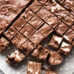 rocky road fudge chopped into small squares on parchment paper