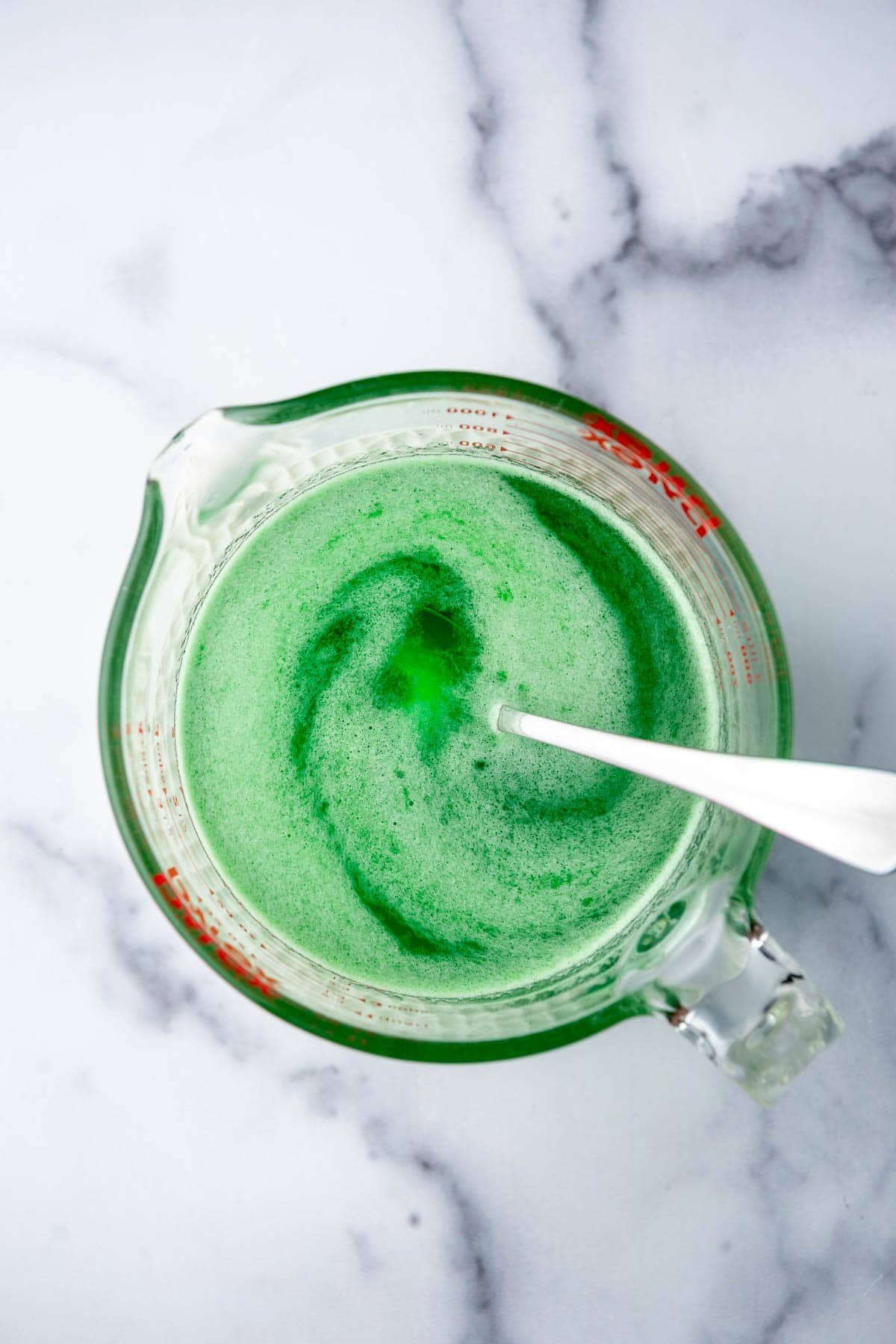 Lime jell-o being dissolved in hot water. - 4