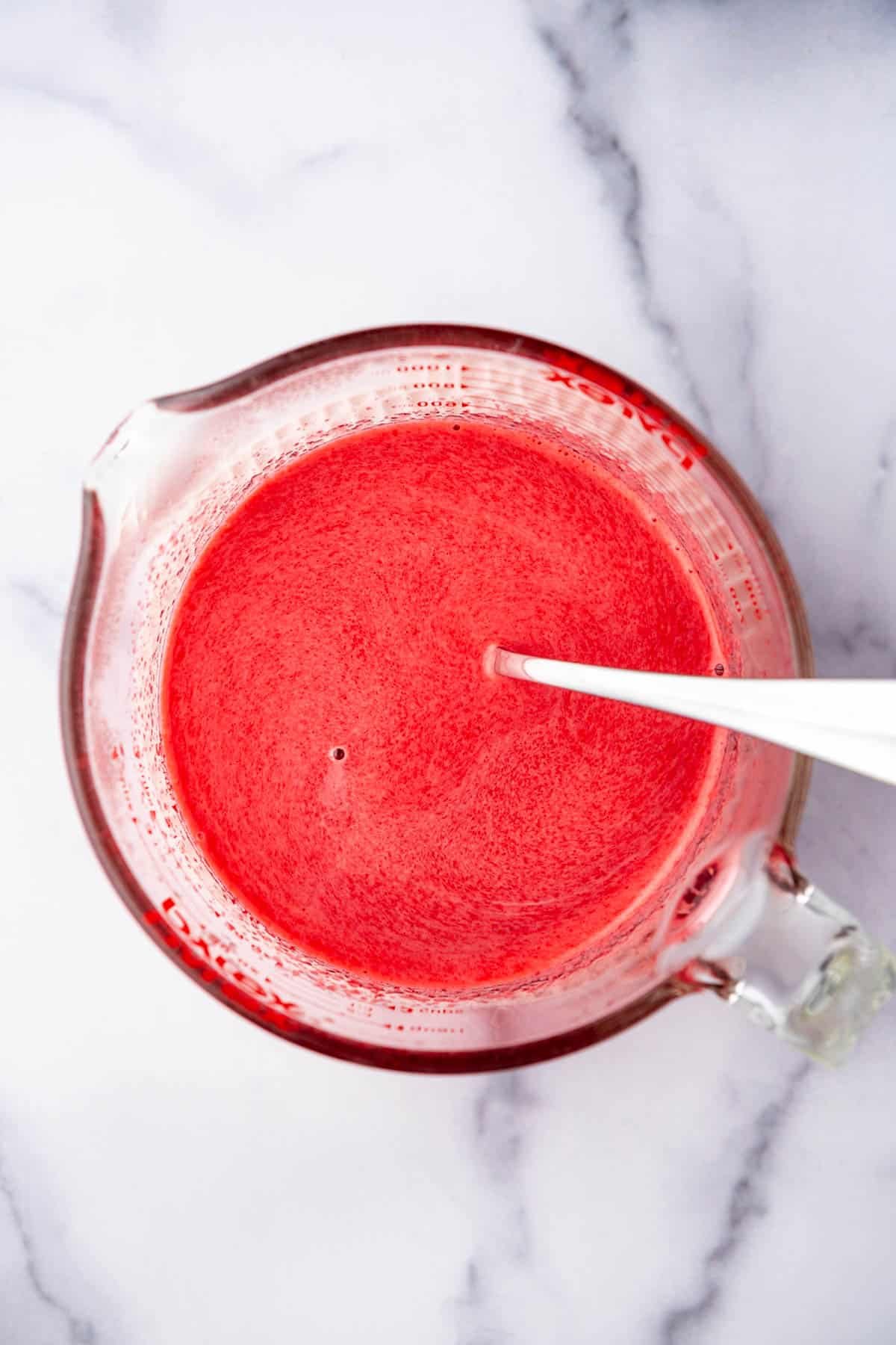 Dissolving cherry gelatin in hot water. - 7