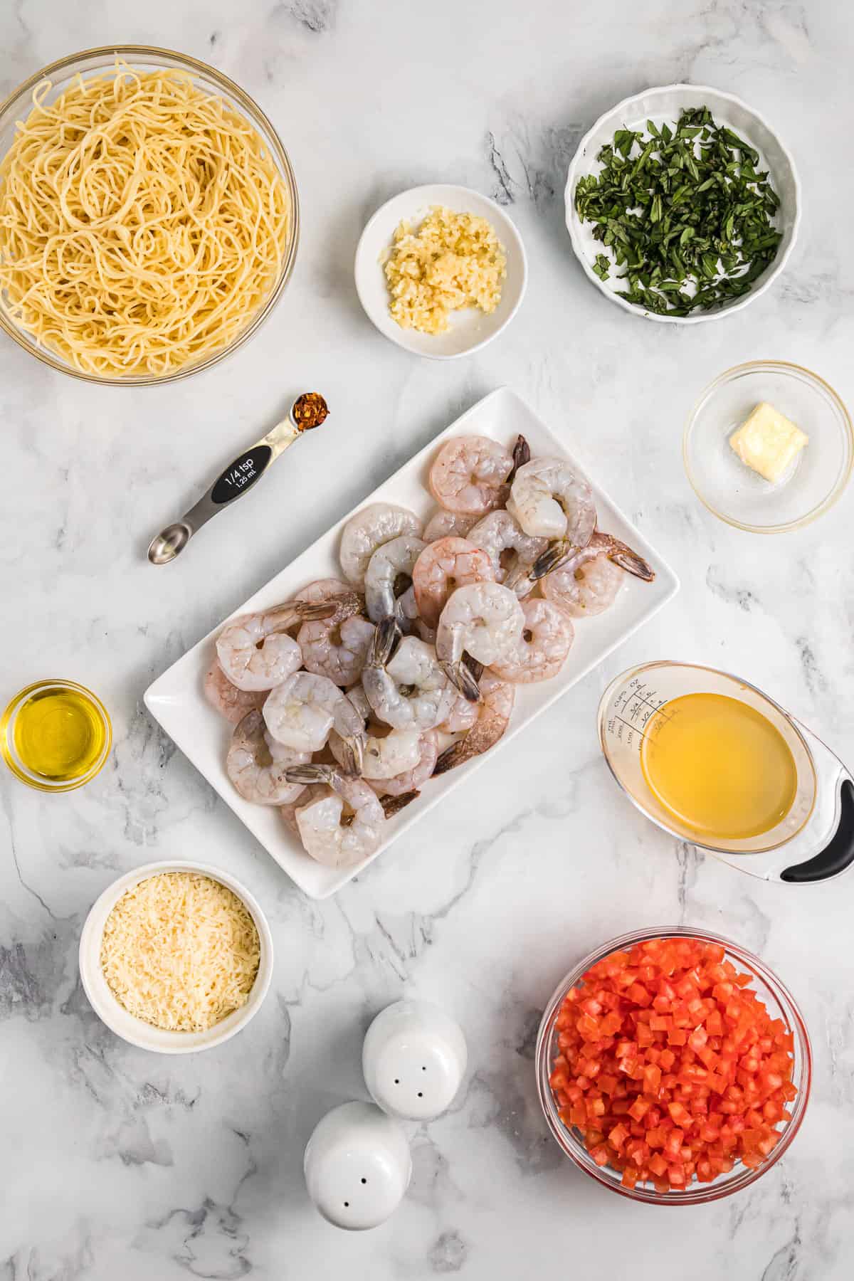 Ingredients for angel hair pasta with shrimp and pomodoro sauce.