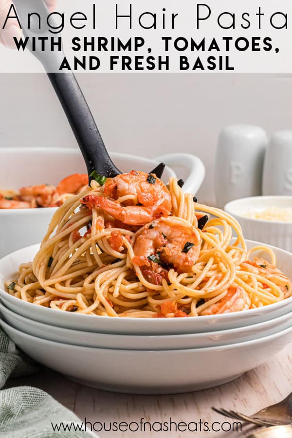 A large bowl of angel hair pasta with shrimp with a serving fork lifting a scoop with text overlay.