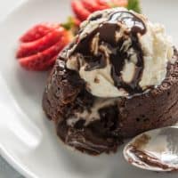 These rich, delicious Chocolate Molten Lava Cakes are sort of like a cross between a soufflé and a flourless chocolate cake, except way easier. They have a deep chocolate flavor with a molten, liquid inside that oozes out once you cut into each individually plated cake.