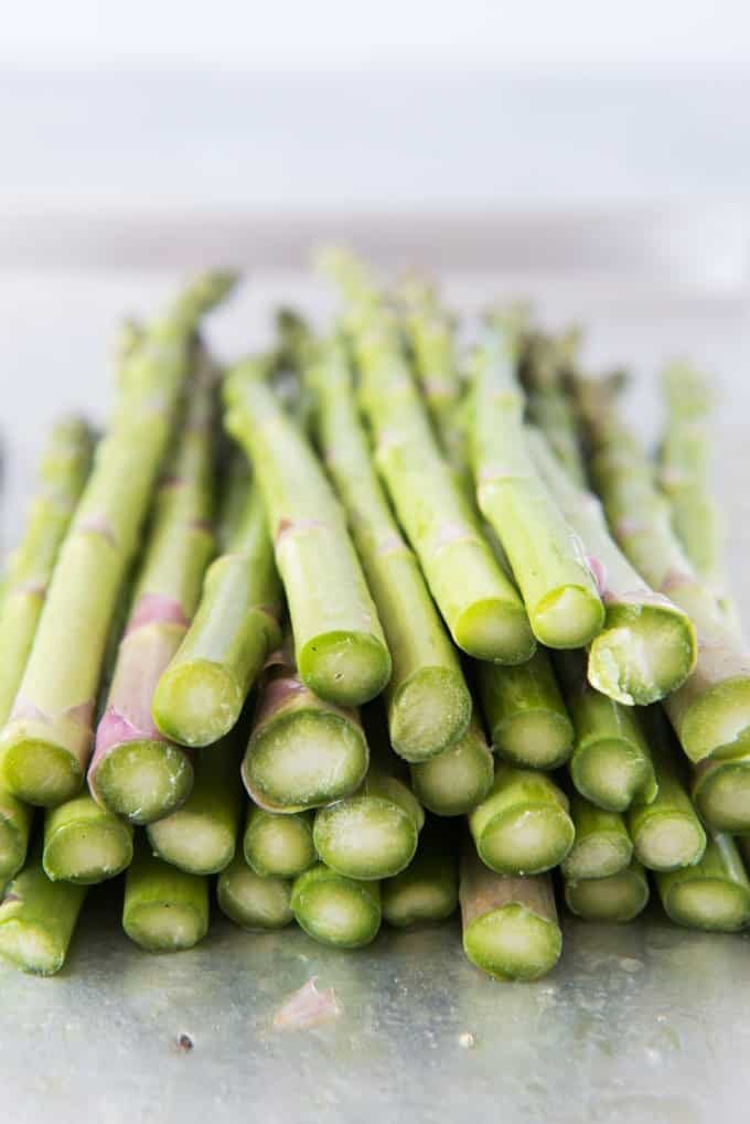 the ends of a pile of asparagus
