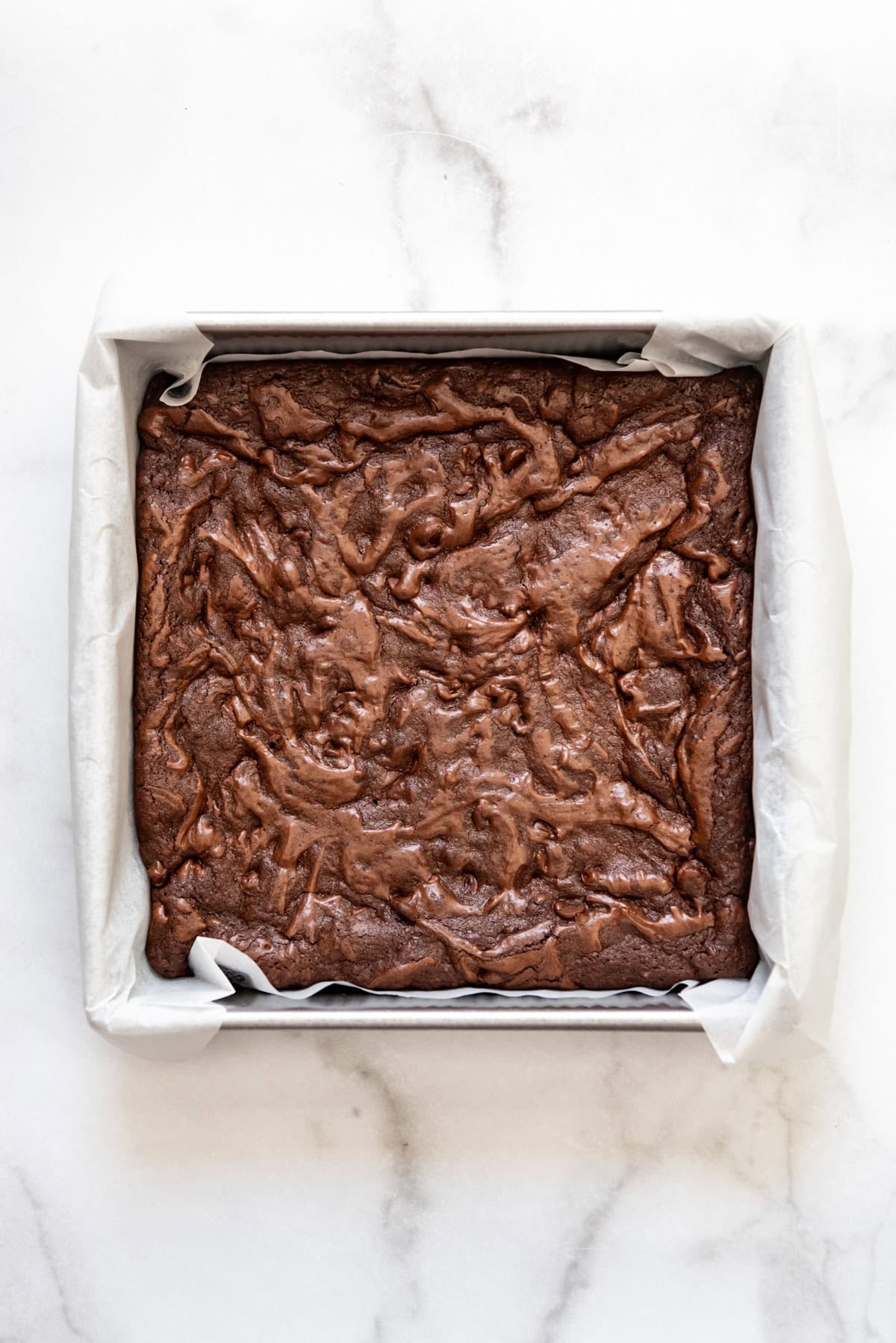 Baked brownies in a square pan.