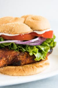 Grilled Cajun Chicken Sandwich with lettuce, tomatoes, onion and sauce