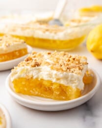 A slice of lemon pineapple jello on a plate.