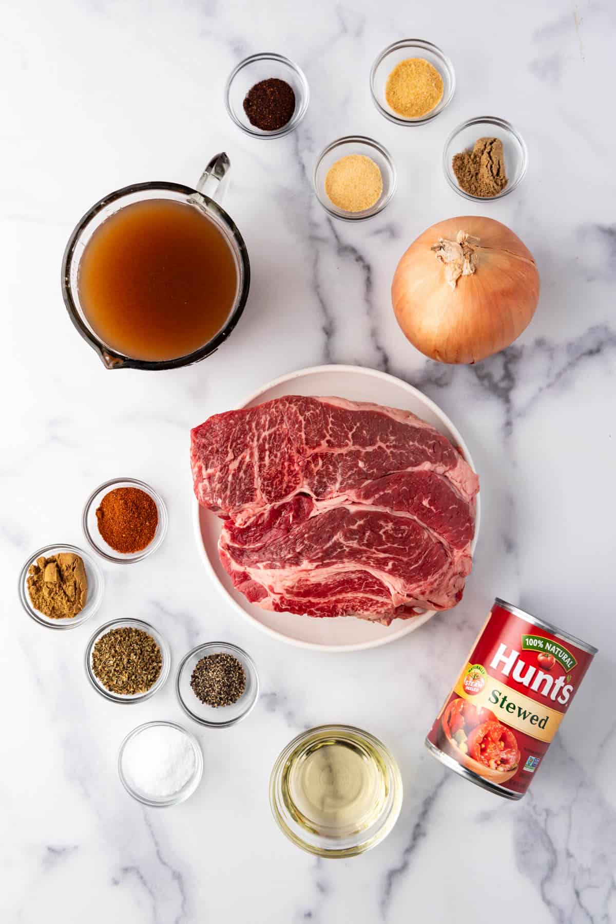 An overhead image of ingredients for making Mexican shredded beef.