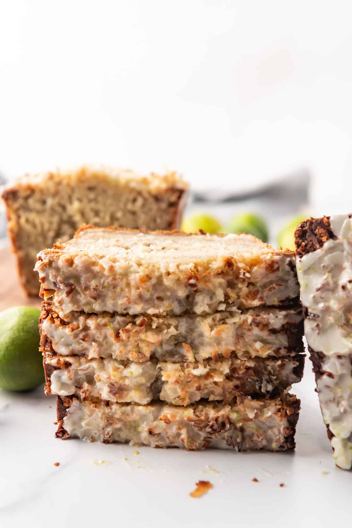 Stacks of coconut lime banana bread stacked on top of each other.