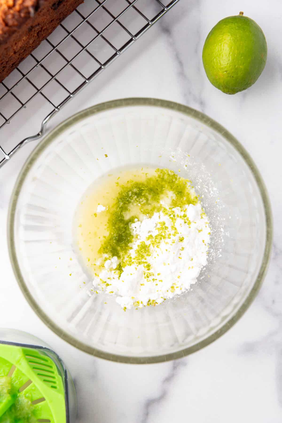 Ingredients for making a lime glaze in a bowl.