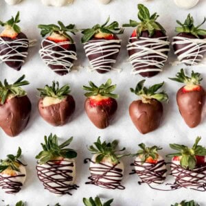 Rows of gourmet chocolate covered strawberries.