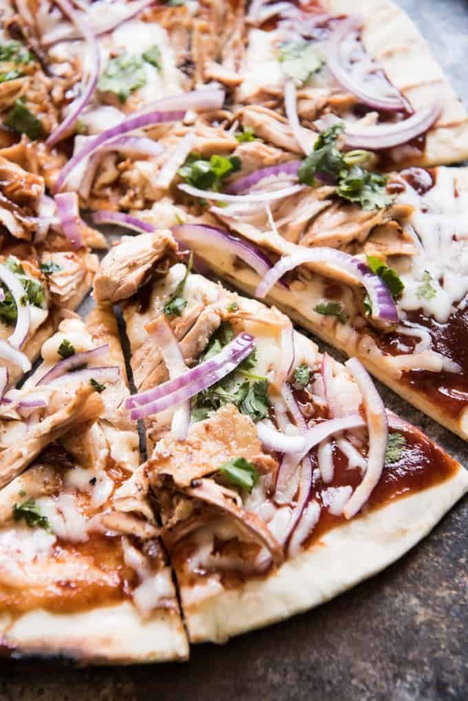 a close up view of a sliced Grilled BBQ Chicken Pizza