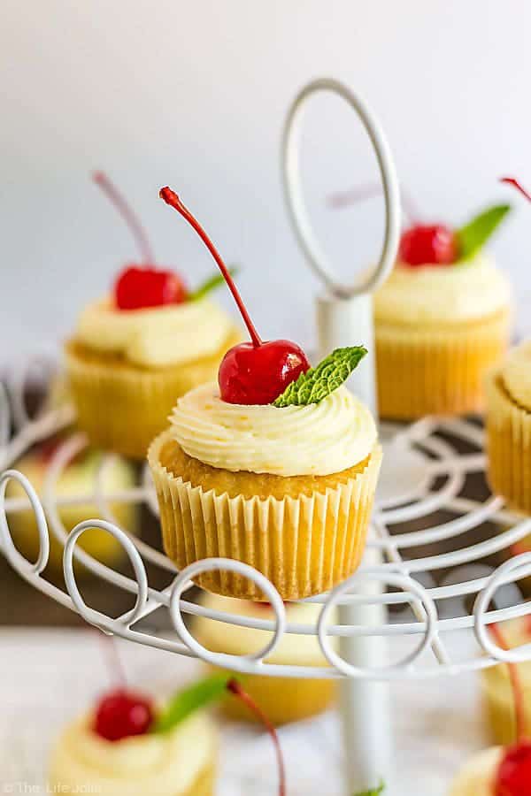 mai tai cupcakes with fresh cherry garnishes