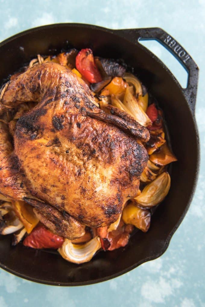 mexican roasted chicken and veggies in a cast iron skillet