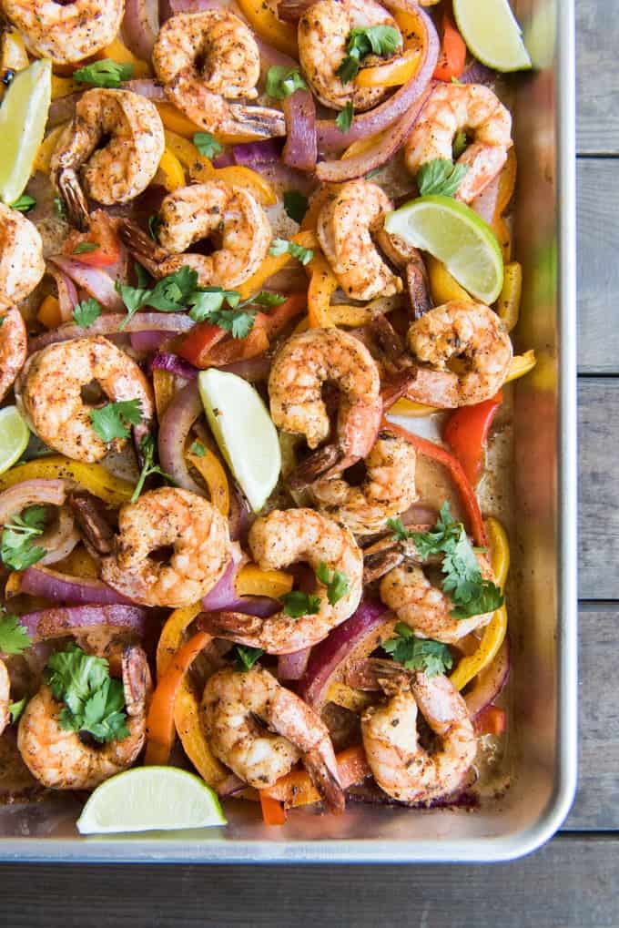 Sheet Pan Shrimp Fajitas is a 30 minute meal recipe that is perfect for busy nights when you don't have a lot of time for cooking or clean up, since the whole dinner cooks on one sheet pan!  Your whole family is going to love this weeknight seafood dinner option that is packed with flavor.  And you are going to love how easy they are to make!