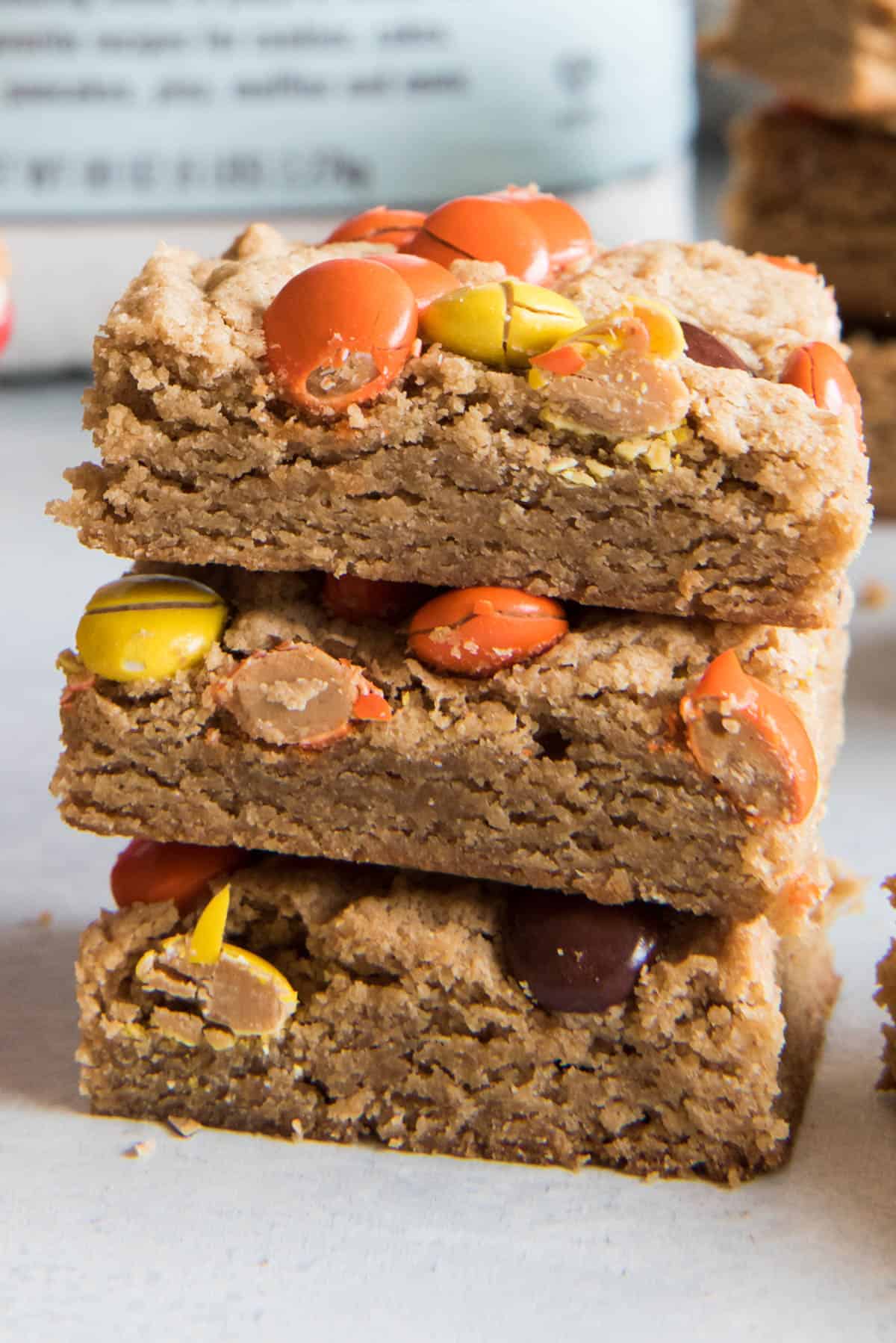 A close image of a stack of peanut butter blondies.