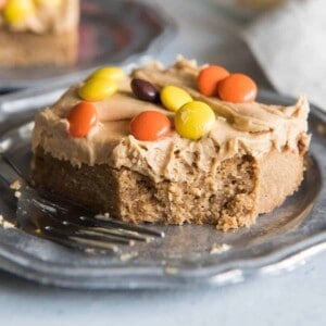 A slice of peanut butter blondie with peanut butter candies on top.