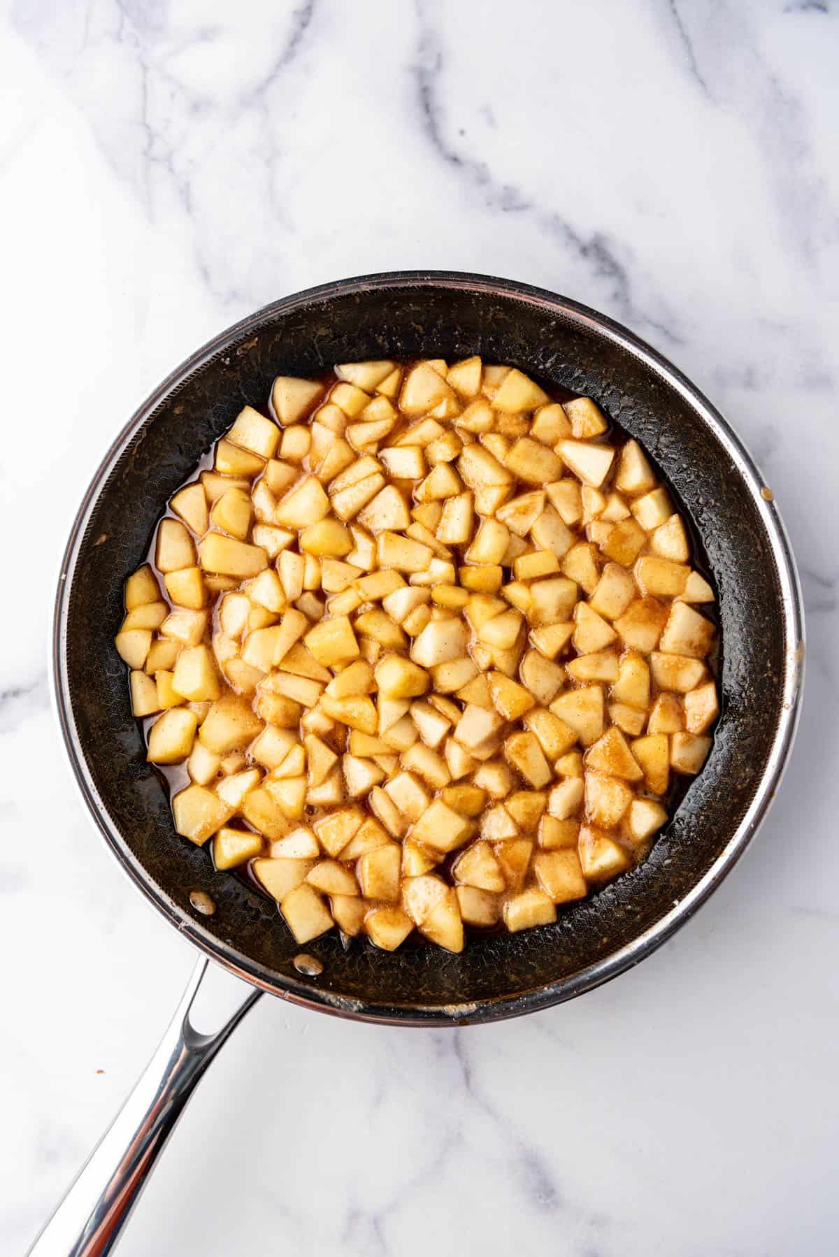 Cooked apples in a pan.