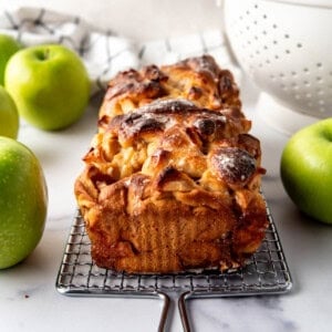 A finished, glazed loaf of apple bread dough.